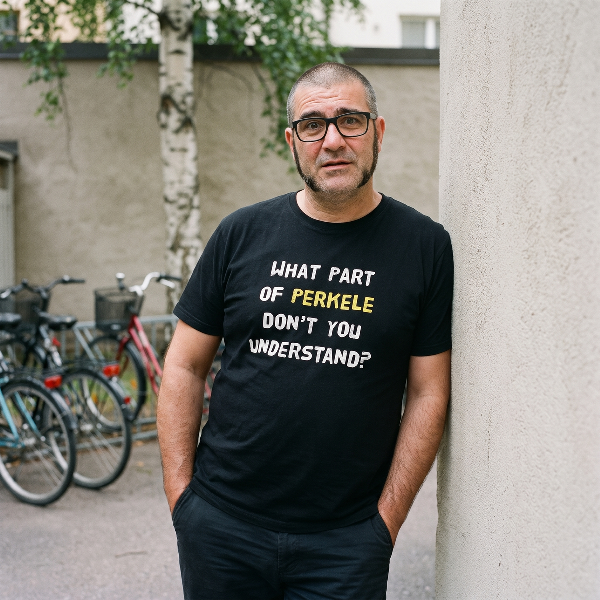 What part of perkele don't you understand t-shirt in black, worn by Jaska by a bike rack, Very Finnish Problems