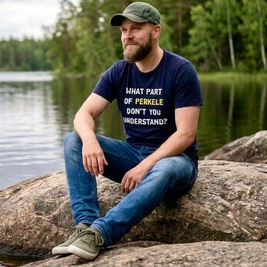Man at a Finnish lake wearing the navy What Part of Perkele Finnish humour t-shirt lifestyle