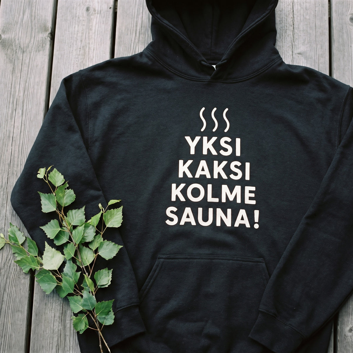 Close-up of the Yksi, kaksi, kolme, sauna! print on black hoodie fleece, Very Finnish Problems