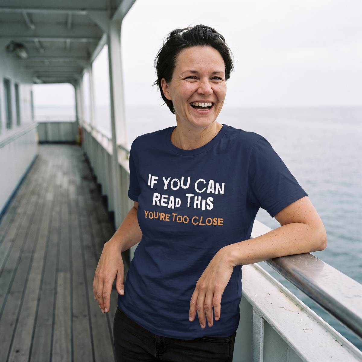 You're Too Close t-shirt in navy, worn by Katja on an empty ferry deck, Very Finnish Problems